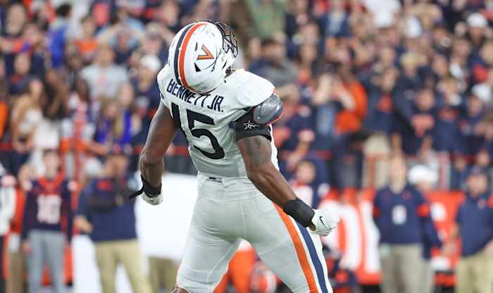 Virginia senior Chico Bennett Jr. celebrates after sacking the quarterback against Syracuse.